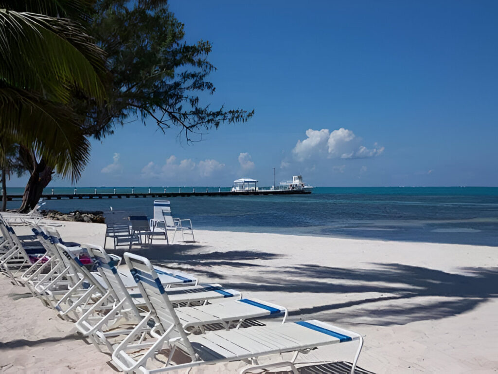 Get away from it all at "Rum and Kai", located at the Retreat in Rum Point. This beach front 1 bedroom condo is located in the stunning upscale vacation home enclave of Cayman Kai on beautiful Grand Cayman. Completely renovated in 2003 with further updates in 2009, this 3rd floor unit is fully equipped with everything you will need for a relaxing beach front vacation. The unit is tastefully decorated with high-end furnishings and the finest linens; all in an understated, yet elegant tropical West Indies motif. Featuring breathtaking beach and ocean views from the fully screened lanai and just steps from both the quiet pool and sandy white beach (fantastic for both swimming and snorkeling). The beach features both Palm and Casuarina trees for ample shade. Rum and Kai is the perfect size (1,039 sq. ft) for couples or a small family looking for a truly stress-free beach holiday. Within walking distance to a pier, you are just minutes from the famous Sting Ray City and Cayman's renowned North Wall, also making Rum & Kai an ideal base for a Dive vacation. With a king size bed, queen size sofa bed and twin pull out bed, Rum and Kai provides ample sleeping options. The fully equipped kitchen and available BBQ grills makes dining-in as easy as if you are home. But, since you are on vacation there are numerous restaurants located nearby. Conveniently next door is the popular Rum Point Club, featuring: restaurants, the Wreck bar, gift shop, water sports and snorkel rentals, dive shop and Sting Ray City trips. The low density complex's amenities include: 1,200 feet of white sandy beach on the ocean (not some lagoon), pool, tennis court, fitness center, on-site management and the most amazing shades of blue the ocean can offer. If your ideal beach vacation is to completely decompress by lounging or reading the day away on an empty beach (in the sun or shade); going for a dip or snorkel in the amazing water of the Caribbean; getting up for a bite to eat or to grab a drink; taking short day trips to see the sights; cooling off by the pool; ending the day by watching the sun set from the comfort of your lounge chairs; cooking in or dining out; then Rum & Kai at the Retreat may just be the place for you.