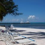 Get away from it all at "Rum and Kai", located at the Retreat in Rum Point. This beach front 1 bedroom condo is located in the stunning upscale vacation home enclave of Cayman Kai on beautiful Grand Cayman. Completely renovated in 2003 with further updates in 2009, this 3rd floor unit is fully equipped with everything you will need for a relaxing beach front vacation. The unit is tastefully decorated with high-end furnishings and the finest linens; all in an understated, yet elegant tropical West Indies motif. Featuring breathtaking beach and ocean views from the fully screened lanai and just steps from both the quiet pool and sandy white beach (fantastic for both swimming and snorkeling). The beach features both Palm and Casuarina trees for ample shade. Rum and Kai is the perfect size (1,039 sq. ft) for couples or a small family looking for a truly stress-free beach holiday. Within walking distance to a pier, you are just minutes from the famous Sting Ray City and Cayman's renowned North Wall, also making Rum & Kai an ideal base for a Dive vacation. With a king size bed, queen size sofa bed and twin pull out bed, Rum and Kai provides ample sleeping options. The fully equipped kitchen and available BBQ grills makes dining-in as easy as if you are home. But, since you are on vacation there are numerous restaurants located nearby. Conveniently next door is the popular Rum Point Club, featuring: restaurants, the Wreck bar, gift shop, water sports and snorkel rentals, dive shop and Sting Ray City trips. The low density complex's amenities include: 1,200 feet of white sandy beach on the ocean (not some lagoon), pool, tennis court, fitness center, on-site management and the most amazing shades of blue the ocean can offer. If your ideal beach vacation is to completely decompress by lounging or reading the day away on an empty beach (in the sun or shade); going for a dip or snorkel in the amazing water of the Caribbean; getting up for a bite to eat or to grab a drink; taking short day trips to see the sights; cooling off by the pool; ending the day by watching the sun set from the comfort of your lounge chairs; cooking in or dining out; then Rum & Kai at the Retreat may just be the place for you.