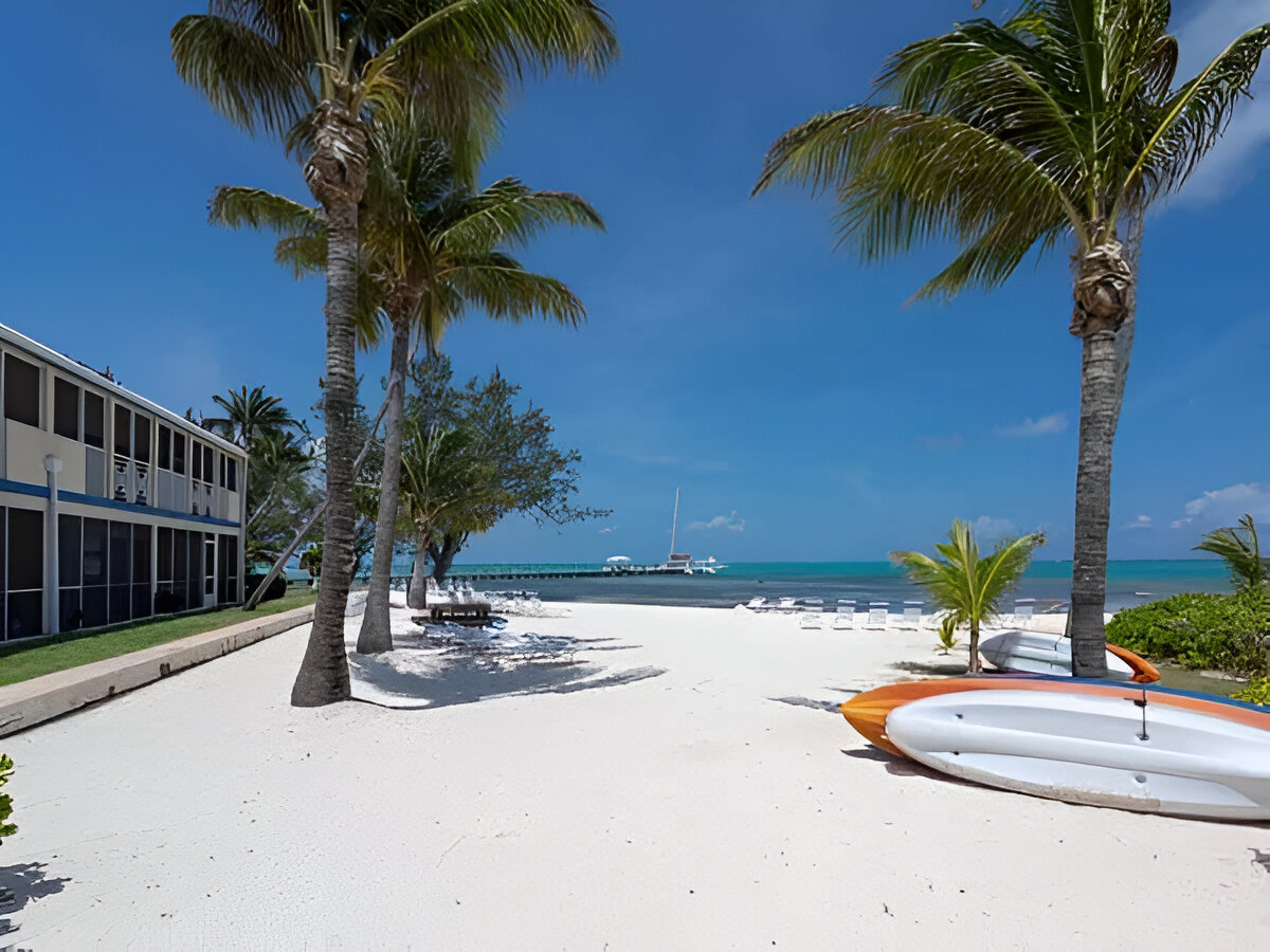 Get away from it all at "Rum and Kai", located at the Retreat in Rum Point. This beach front 1 bedroom condo is located in the stunning upscale vacation home enclave of Cayman Kai on beautiful Grand Cayman. Completely renovated in 2003 with further updates in 2009, this 3rd floor unit is fully equipped with everything you will need for a relaxing beach front vacation. The unit is tastefully decorated with high-end furnishings and the finest linens; all in an understated, yet elegant tropical West Indies motif. Featuring breathtaking beach and ocean views from the fully screened lanai and just steps from both the quiet pool and sandy white beach (fantastic for both swimming and snorkeling). The beach features both Palm and Casuarina trees for ample shade. Rum and Kai is the perfect size (1,039 sq. ft) for couples or a small family looking for a truly stress-free beach holiday. Within walking distance to a pier, you are just minutes from the famous Sting Ray City and Cayman's renowned North Wall, also making Rum & Kai an ideal base for a Dive vacation. With a king size bed, queen size sofa bed and twin pull out bed, Rum and Kai provides ample sleeping options. The fully equipped kitchen and available BBQ grills makes dining-in as easy as if you are home. But, since you are on vacation there are numerous restaurants located nearby. Conveniently next door is the popular Rum Point Club, featuring: restaurants, the Wreck bar, gift shop, water sports and snorkel rentals, dive shop and Sting Ray City trips. The low density complex's amenities include: 1,200 feet of white sandy beach on the ocean (not some lagoon), pool, tennis court, fitness center, on-site management and the most amazing shades of blue the ocean can offer. If your ideal beach vacation is to completely decompress by lounging or reading the day away on an empty beach (in the sun or shade); going for a dip or snorkel in the amazing water of the Caribbean; getting up for a bite to eat or to grab a drink; taking short day trips to see the sights; cooling off by the pool; ending the day by watching the sun set from the comfort of your lounge chairs; cooking in or dining out; then Rum & Kai at the Retreat may just be the place for you.